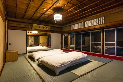 Voodi või voodid majutusasutuse Temple Hotel Takayama Zenkoji toas