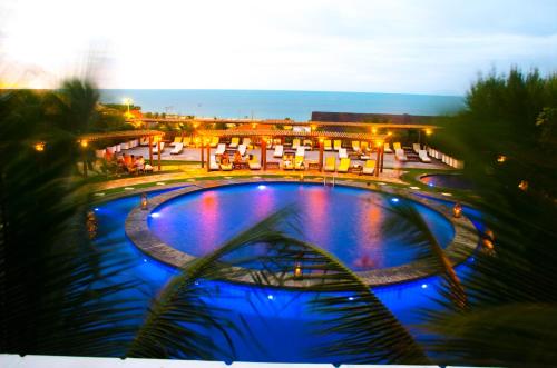 a view of a swimming pool at a resort at Long Beach in Canoa Quebrada