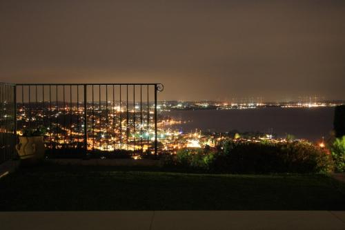 a view of a city at night at Casaliva Relais in Bardolino