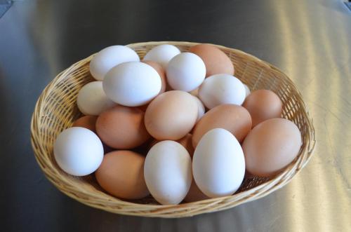 a basket of eggs sitting on a table at Gasthof Alte Tanne in Hof bei Salzburg