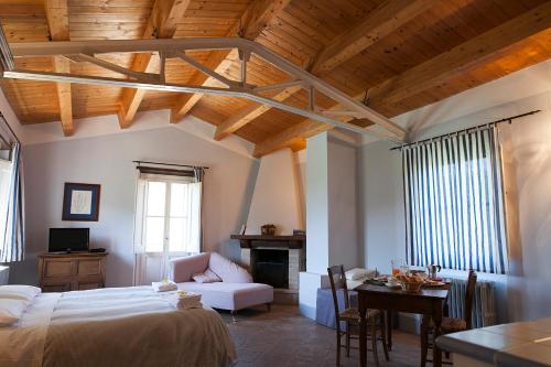 Cama ou camas em um quarto em Re Artù Assisi Country Lifestyle