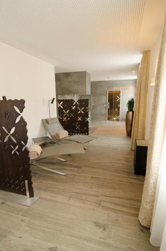 a hallway with wooden flooring in a building at Gasthof Goldener Fisch in Lienz