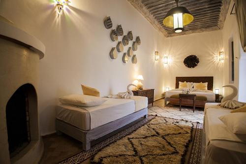 Säng eller sängar i ett rum på Riad De Vinci & SPA