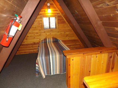 an attic room with a bench and a fire hydrant at Arizona Mountain Inn & Cabins in Flagstaff