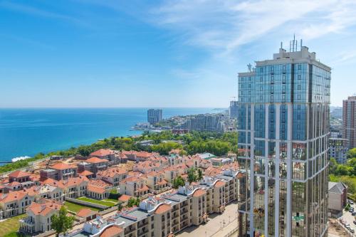an aerial view of a city with a tall building at Apartment Frantsuzky Bulvar 60 G in Odesa