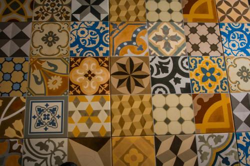 a bunch of different types of tiles on a wall at Pousada Pedra da Gaivota in Bombinhas