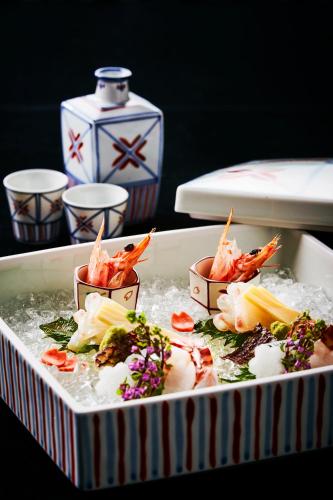 a tray of food with shrimp and ice on a table at Ubusuna no Sato TOMIMOTO in Ando