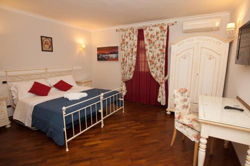 Postel nebo postele na pokoji v ubytování Hotel Ausonia