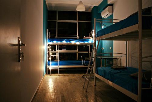 a room with two bunk beds and a hallway at Acropolis View Dream 2 in Athens