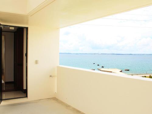 Gallery image of Kariyushi Condominium Ocean Hills Chouraku Stay in Kin