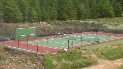 a tennis court on top of a hill at Keepers Cottage in Forsinain