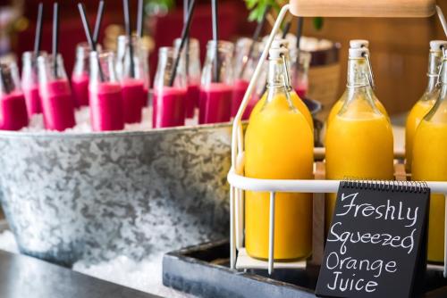 a bunch of bottles of orange juice on a counter at Radisson Blu Resort El Quseir in Quseir