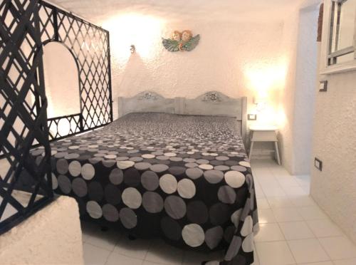 A bed or beds in a room at Il Nido 1