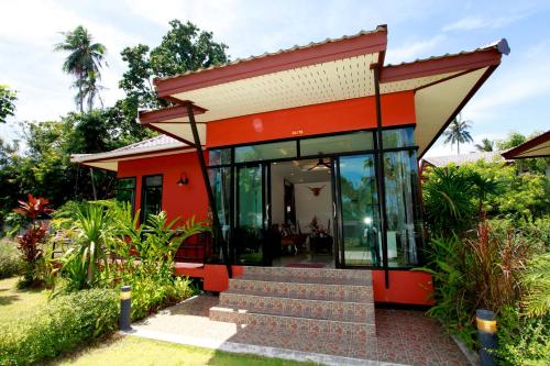a small house with a red roof at Saree Lagoon Villa Koh Samui in Lipa Noi
