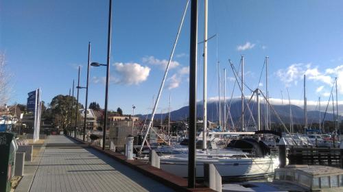 a dock with boats docked in a marina at Natone in Hobart