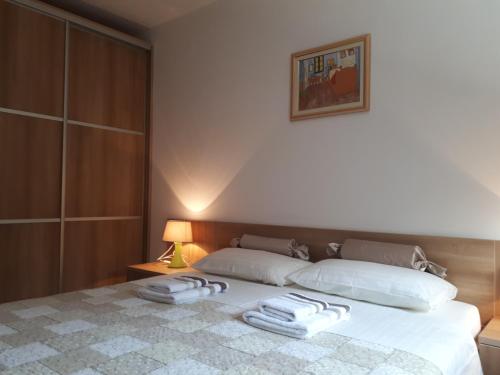 Postel nebo postele na pokoji v ubytování Apartments Bosco
