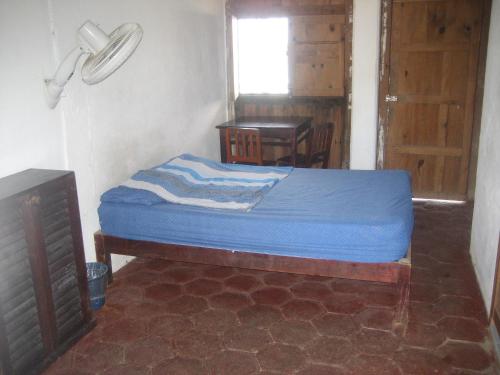 Ένα ή περισσότερα κρεβάτια σε δωμάτιο στο Posada Brisa Marina