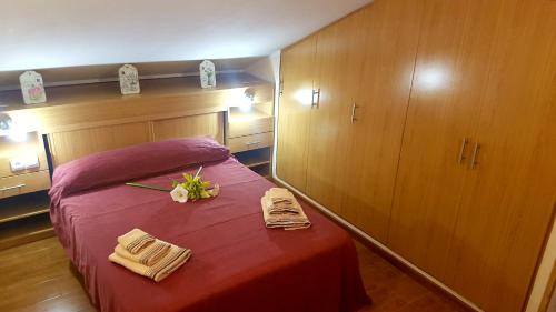 מיטה או מיטות בחדר ב-Apartamentos La Guertina