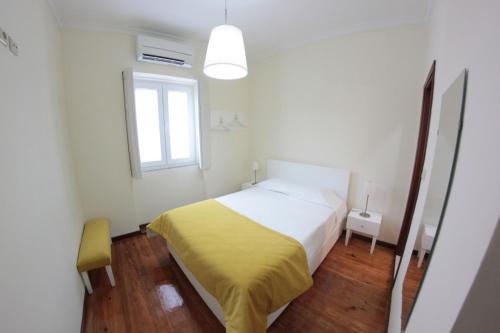 Ένα ή περισσότερα κρεβάτια σε δωμάτιο στο Huga Home