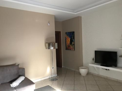 TV a/nebo společenská místnost v ubytování Pompei Home Apartament