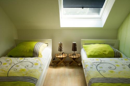Postel nebo postele na pokoji v ubytování Komfortable Apartments in der Villa Eule