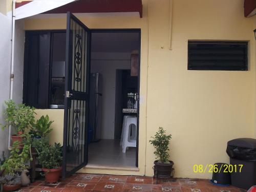 an open door to a room with plants in it at La Casa del Chac in Mérida