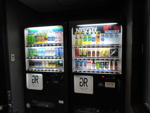 two vending machines with drinks and drinks in them at Green Rich Hotel Hamada Ekimae (Artificial hot spring Futamata Yunohana) in Hamada