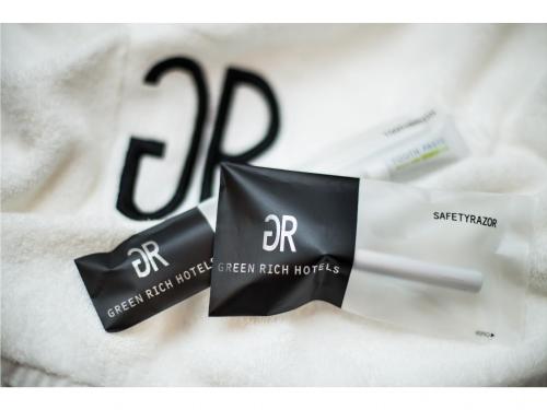 a close up of two products on a white blanket at Green Rich Hotel Hamada Ekimae (Artificial hot spring Futamata Yunohana) in Hamada