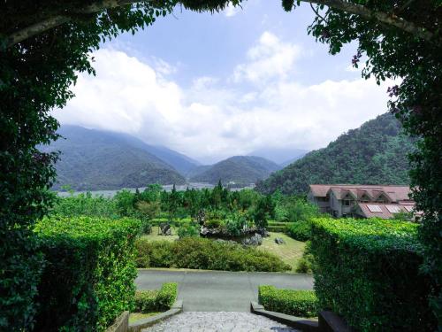 a view from a resort with mountains in the background at Chilan Hotel in Datong