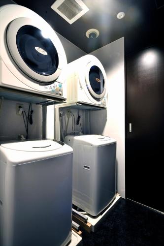 a room with two security cameras on a wall at Green Rich Hotel Iwakuni Ekimae (Artificial hot spring Futamata Yunohana) in Iwakuni