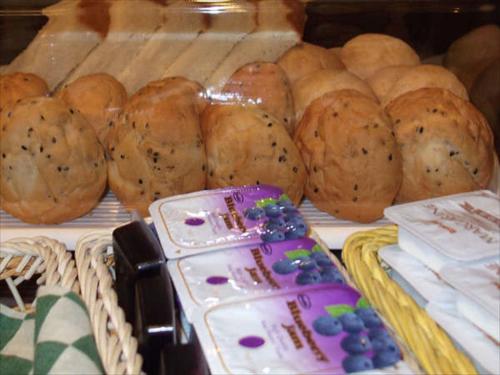 a display of loaves of bread in a bakery at Green Rich Hotel Iwakuni Ekimae (Artificial hot spring Futamata Yunohana) in Iwakuni