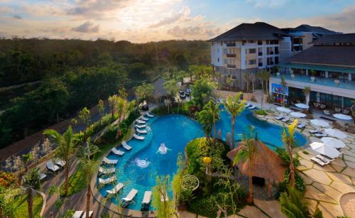an overhead view of a pool at a resort at Royal Tulip Springhill Resort Jimbaran in Jimbaran
