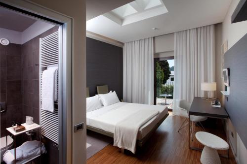 Postel nebo postele na pokoji v ubytování Alter Hotel