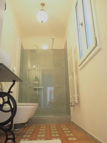 a bathroom with a shower and a bath tub at Casa Mongolfiere Venezia in Venice