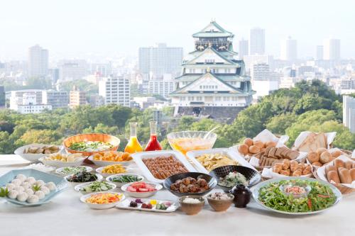 a table with many different types of food on it at KKR Hotel Osaka in Osaka