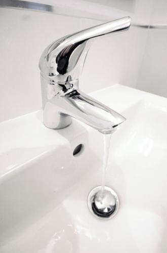 a sink faucet with water coming out of it at Humber Royal Hotel in Grimsby