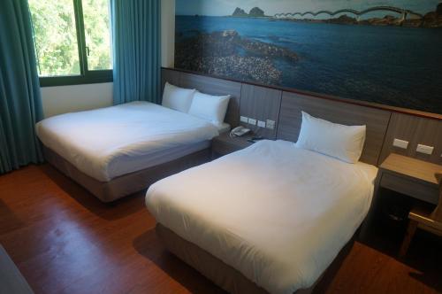 Cama o camas de una habitación en CHIILIH HOTEL- Su ao