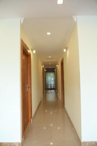 an empty corridor in a building with a hallway at Anna Residency in Nedumbassery