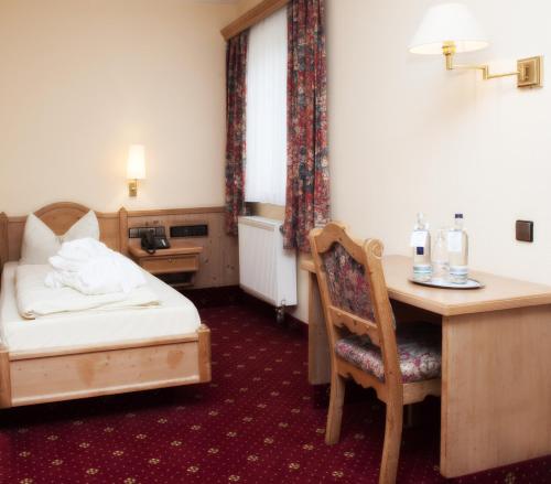 Ένα ή περισσότερα κρεβάτια σε δωμάτιο στο Ringhotel Nassau-Oranien