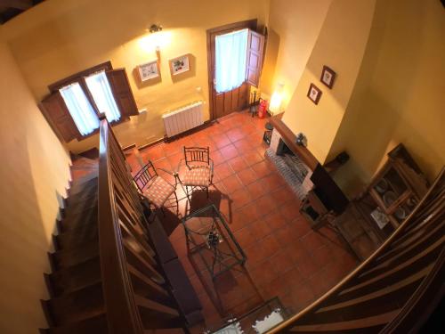 an overhead view of a living room with a staircase at El Bulin de Horcajuelo in Horcajuelo de la Sierra