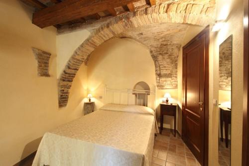 מיטה או מיטות בחדר ב-Residence Borgo Da Mare