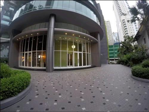 a large building with a lot of windows at VORTEX SUITES KLCC by PNUT With NETFLIX in Kuala Lumpur