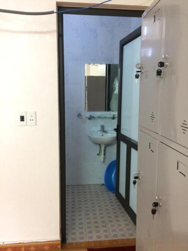 a bathroom with a sink and a mirror at Ngan Ha Homestay in Ha Giang