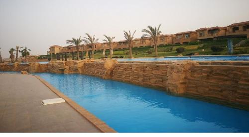 The swimming pool at or close to Twin House in Telal