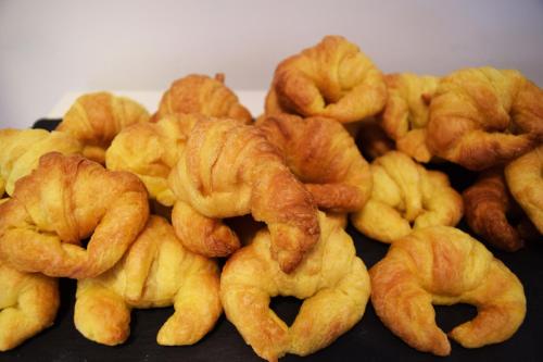 a pile of fried onion rings on a table at Hotel New Bilbao Airport in Derio