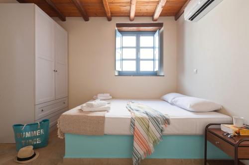 Ένα ή περισσότερα κρεβάτια σε δωμάτιο στο Pserimos Villas