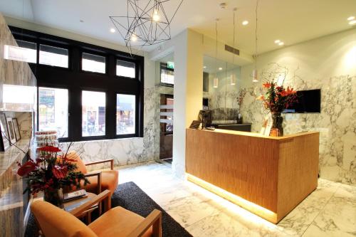 a lobby of a store with a reception desk at The Bank Hotel in Amsterdam