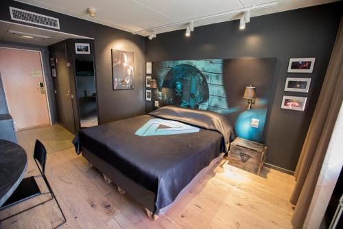 a bedroom with a large bed in a room at Original Sokos Hotel Vaakuna Mikkeli in Mikkeli