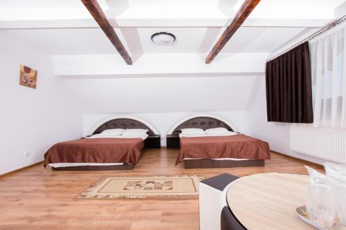Un pat sau paturi într-o cameră la Complex Panoramic