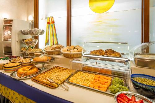 a buffet filled with lots of different types of food at Hotel Centrale in Mestre